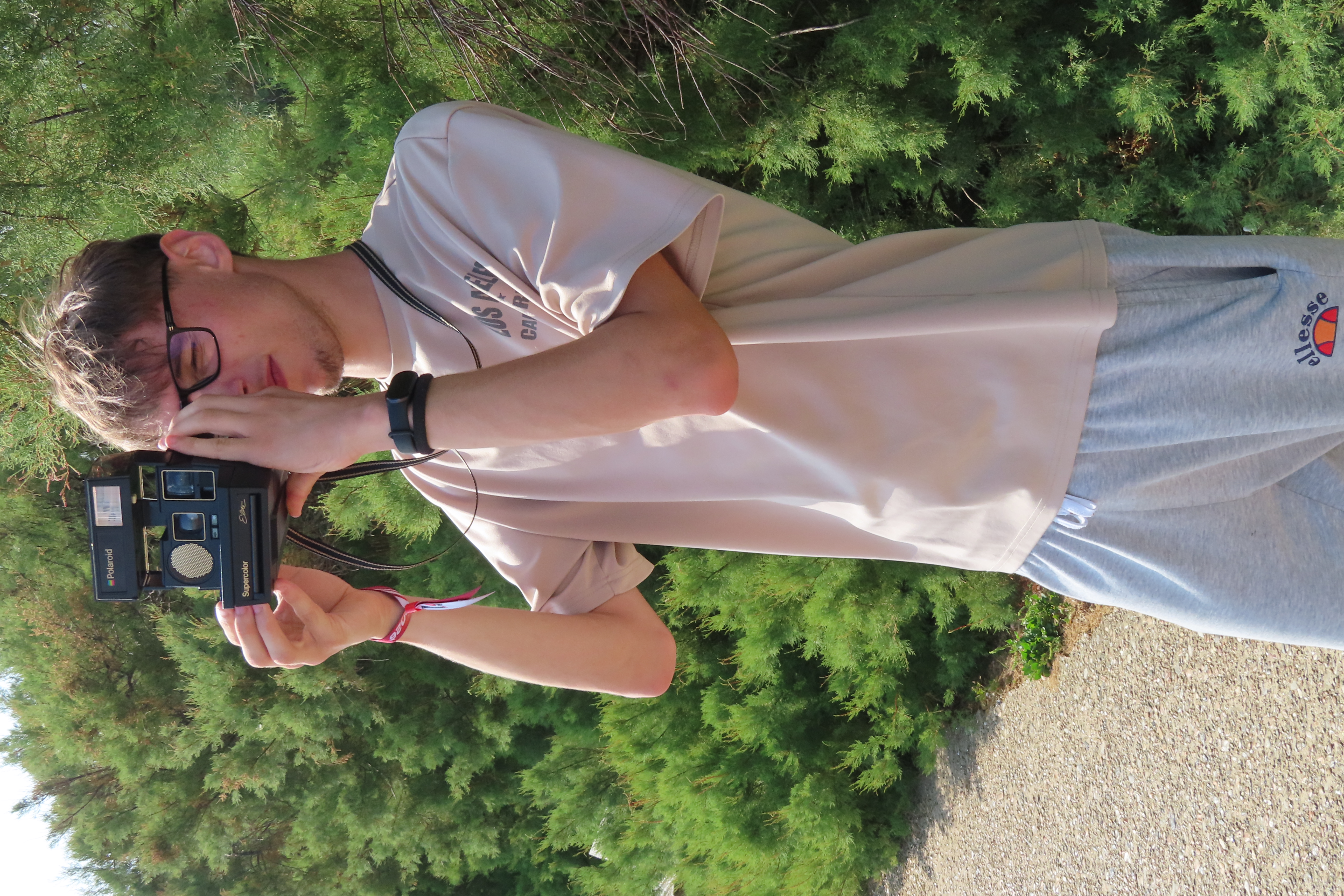 Photographer using a Polaroid camera